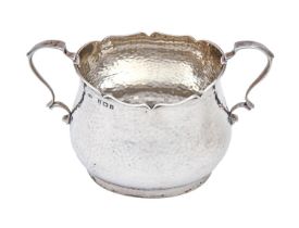 An Edwardian silver sugar bowl, hammer textured, 85mm h, by Deakin & Francis Ltd, Birmingham 1905,