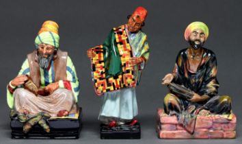 Three Royal Doulton earthenware orientalist figures, circa second quarter 20th c, comprising