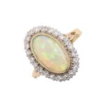 An opal and diamond ring, in 18ct gold, head 13 x 19mm, London 1981, 5.5g, size N Good condition,