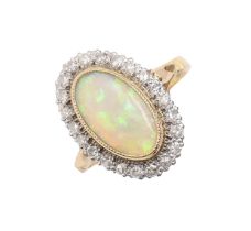 An opal and diamond ring, in 18ct gold, head 13 x 19mm, London 1981, 5.5g, size N Good condition,