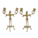 A pair of cast brass figural candelabra, on three legs, 22cm h Complete, slightly bent but otherwise
