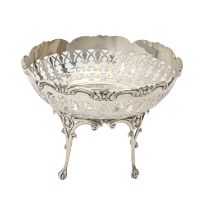 A George V pierced silver sweetmeat bowl, on four pierced legs with claw and ball feet, 12cm h, by