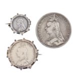 Silver coins. United Kingdom crown 1889 and two other Victorian mounted silver coins (3)