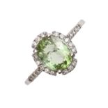 A peridot and diamond ring, in 18ct white gold, Birmingham, no date letter, 4g, size M Good
