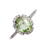A peridot and diamond ring, in 18ct white gold, Birmingham, no date letter, 4g, size M Good