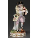 A German figure of a musician, 19th / early 20th c after a Meissen model, on round gilt base, 17cm