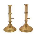 Two English brass ejector candlesticks, first half 18th c, 23.5 and 24.5cm h Typical wear and