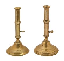 Two English brass ejector candlesticks, first half 18th c, 23.5 and 24.5cm h Typical wear and