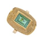 A tourmaline ring, the rectangular step cut green tourmaline in domed and beaded setting, in gold,