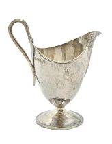 Omar Ramsden. An Arts & Crafts silver cream jug, on round foot, hammer textured, 11.5cm h, maker's