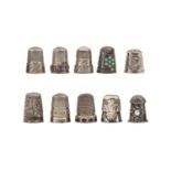 A Scottish silver and pebble stone-inset thimble and nine various other silver thimbles, one