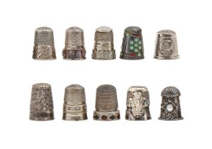 A Scottish silver and pebble stone-inset thimble and nine various other silver thimbles, one