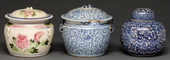 A Chinese blue and white jar and cover, 19th c, painted with flowers and leafy meander, metal loop