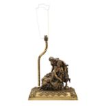 A lacquered brass sculptural lamp, late 19th c, the raised rectangular base set with the figures