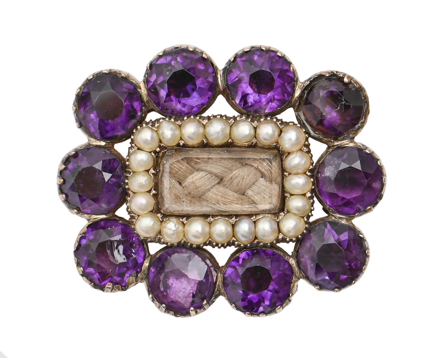 An early Victorian split pearl and foiled amethyst mourning brooch, in gold, 27mm, 6.3g Wear and