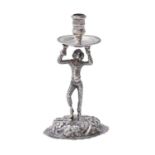 A Continental silver Harlequin figural chamberstick, 20th c, 12cm h, apparently unmarked, 3ozs 3dwts