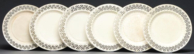 One, a pair and set of three pierced creamware plates, 19th c, with fluted cavetto, 23.5cm diam