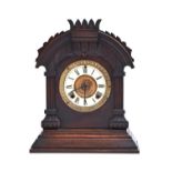 A North American stained wood shelf clock, Ansonia Clock Co New York, patented June 18 1892, with