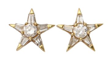 A pair of star shaped diamond ear studs, in 18ct gold, star 9mm, 2.1g Stem of one bent but unbroken