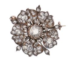 A Belle Epoque diamond brooch, c1900, designed as a flower, with round and cushion shaped old cut