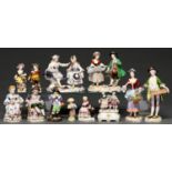 Twelve Sitzendorf and other German porcelain figures and groups, late 19th c and later, to include a