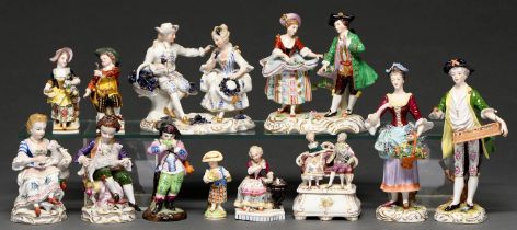 Twelve Sitzendorf and other German porcelain figures and groups, late 19th c and later, to include a