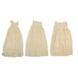 A group of late Victorian and Edwardian christening gowns and baby's clothes and two contemporary