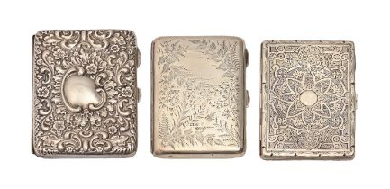 One Edwardian and two Victorian silver card cases, die stamped or engraved, leather lined, two