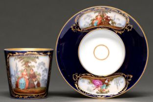 A German porcelain trembleuse cup and saucer, late 19th / early 20th c, painted with couples