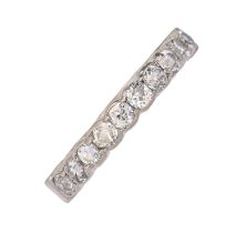 A white stone half eternity ring, in white gold coloured metal, 4.8g, size Q Settings worn