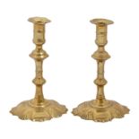 Two English brass candlesticks, mid 18th c, with mushroom knop, on shell foot, 18cm h Good condition