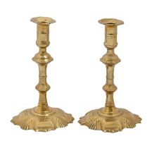 Two English brass candlesticks, mid 18th c, with mushroom knop, on shell foot, 18cm h Good condition