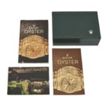 A Rolex sycamore lined wristwatch box, several related Rolex booklets, etc 14.5cm l Good condition