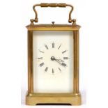 A French brass carriage clock, late 19th c, with gong striking movement, the silvered platform