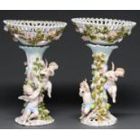 A pair of Plaue floral encrusted fruit stands and detachable baskets, late 19th c, of open trellis