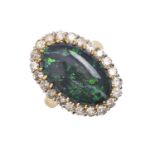 A black opal and diamond cluster ring, in gold marked 18ct, 17 x 24mm, 8.9g, size L Opal with two