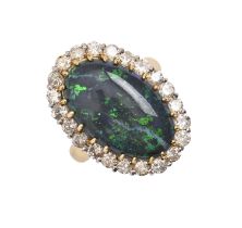 A black opal and diamond cluster ring, in gold marked 18ct, 17 x 24mm, 8.9g, size L Opal with two