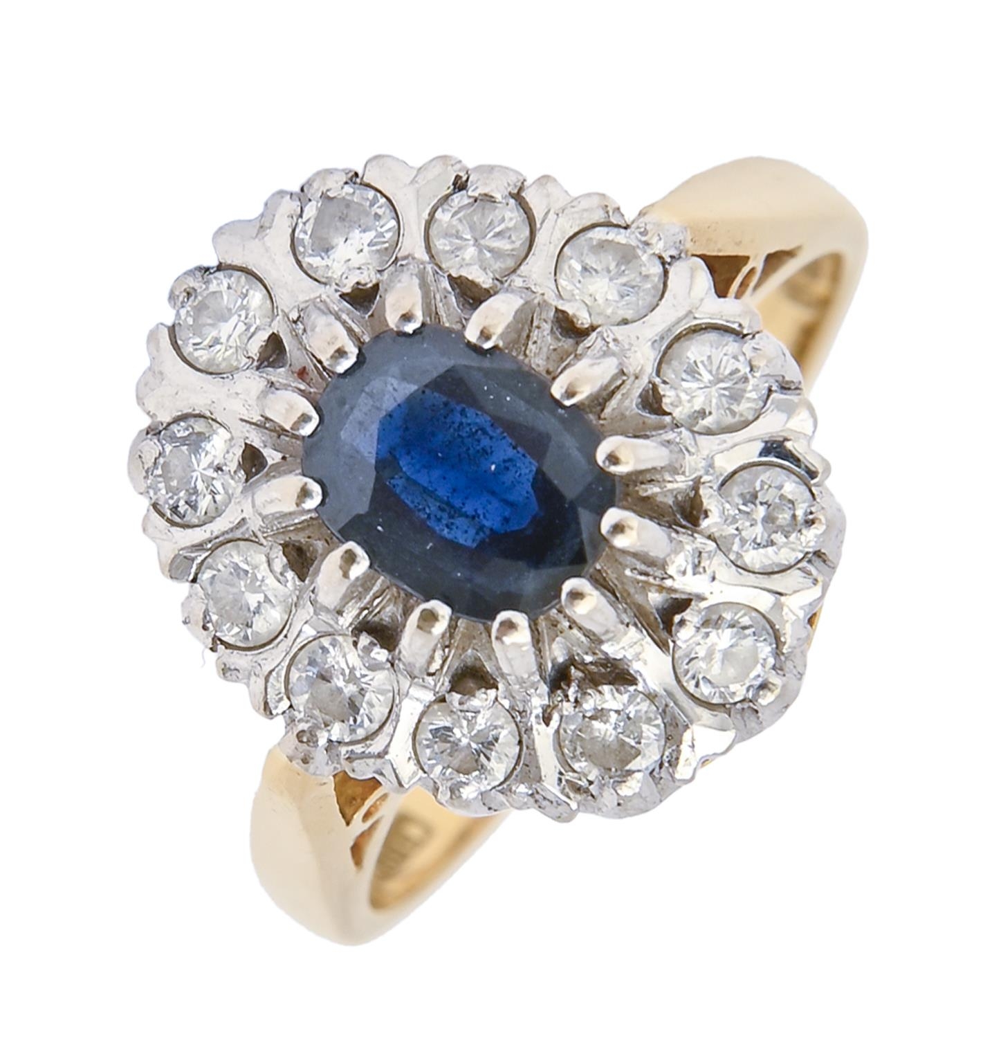 A sapphire and diamond cluster ring, in 18ct gold, London 1976, 7.5g, size N Good condition