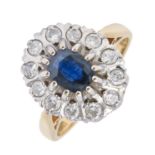 A sapphire and diamond cluster ring, in 18ct gold, London 1976, 7.5g, size N Good condition