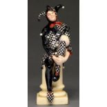A Royal Doulton earthenware figure of a jester designed by C J Noke, 1915-1938, 25cm h, incised,