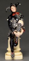 A Royal Doulton earthenware figure of a jester designed by C J Noke, 1915-1938, 25cm h, incised,