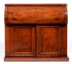 A Victorian mahogany bureau, with cylinder front and sliding interior above panelled doors, 94cm