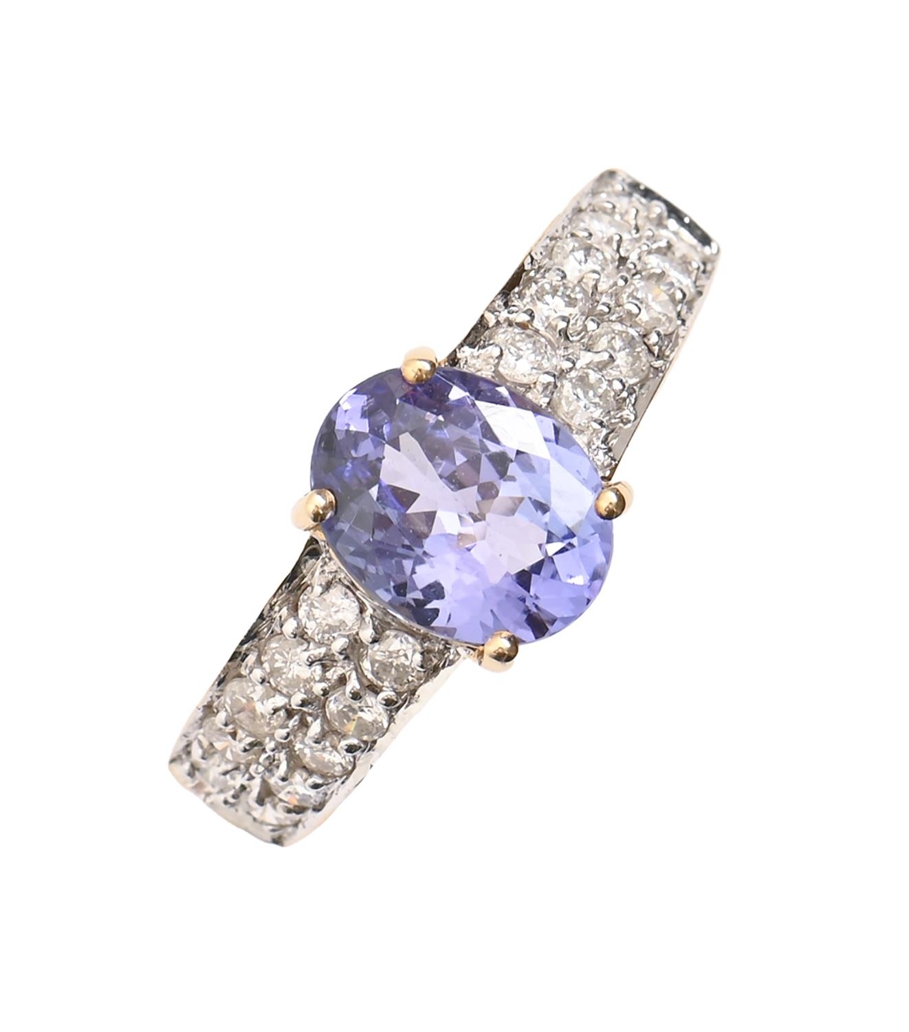 A tanzanite and diamond ring, in 18ct gold, marks obscured, 5.2g, size Q Good condition