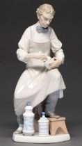 A Lladro figure of a chemist, 32cm h, printed mark Good condition