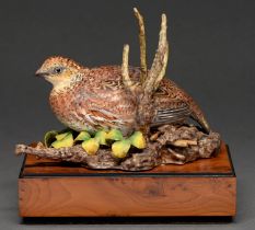 A Royal Worcester model of a bob-white quail, designed by Ronald van Ruyckevelt, 1969, on yew wood