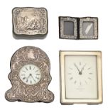 An Elizabeth II silver framed strut timepiece and three other silver mounted articles, all in