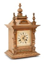 A German walnut mantel clock, early 20th c, with Junghans gong striking movement, pendulum, 45cm h