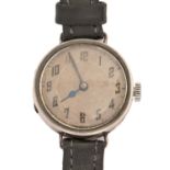 A silver wristwatch, wire lugs, 26mm diam, import marked London 1924 Movement running when wound and