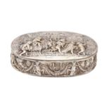 An oval Dutch silver trinket box, the lid and sides chased with a bacchanal, 15.5cm l, spurious 18th