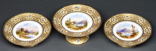 A set of three Coalport fruit stands, c1890, painted to the centre with a mountainous landscape, the